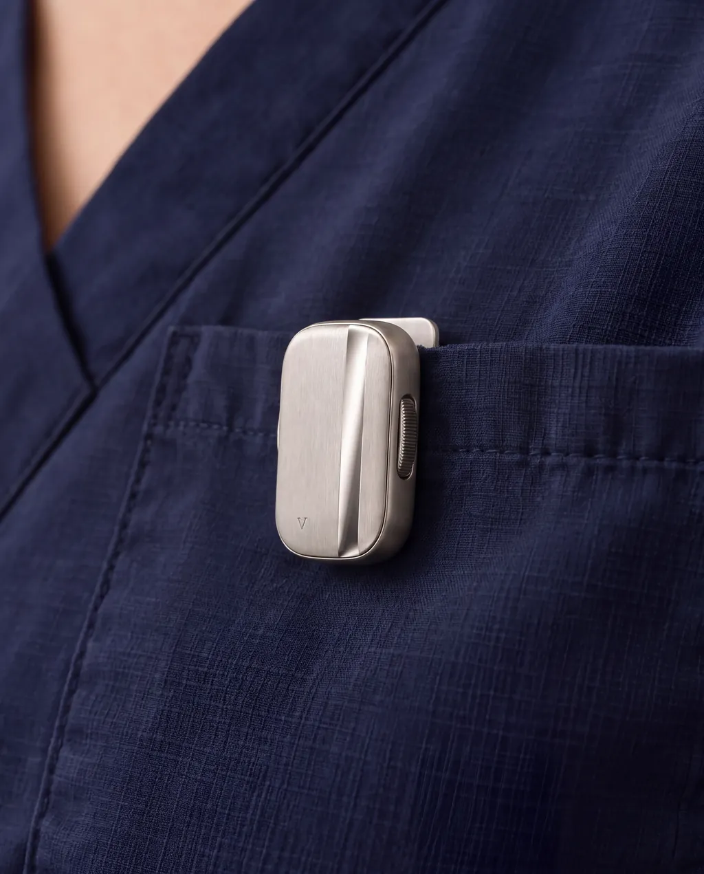 The Vault capsule clipped to a navy scrub pocket.